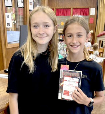 London Waggoner PHS Volleyball player volunteering and Halli Darnell student reader at a Tuesday Read to Me Day.