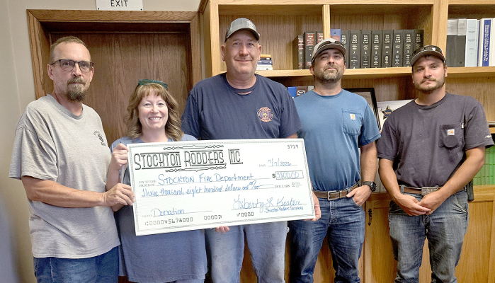 DURING THE STOCKTON CITY COMMISSION MEETING on Tuesday, July 7th, the Stockton Fire Department was presented with a $3,800.00 donation check from the Stockton Rodders, Inc. from the proceeds of their annual Cruise Night and Car Show. The funds will go to purchase much-needed equipment for the department. Pictured are (from left) Adam Bryant and Libby Kester representing the Stockton Rodders, fire chief Ray Niblock and firemen Mitch Gibbs and Riley Wise.