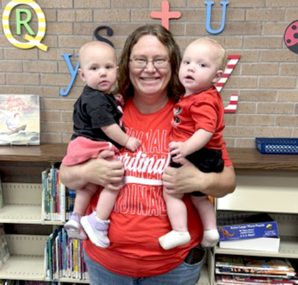 BERNICE BIRDSALL with her twin grandchildren Ella and Jack Rohr at the Grandparents Day at the library.