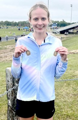 Cheyenne Hoeting with her 3200 &amp; 1600 Meter Medals she captured at Regionals (Courtesy Photo)