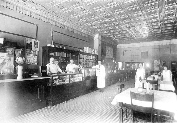 IN THE EARLY 1900S, the Royal Cafe was owned and operated by Jim and Rose Gilbert. The Royal Cafe was located in the building that was later occupied by the Unrein Drug Store. The persons in the picture were not identified.