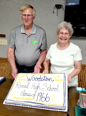 MAX LINN DIBBLE and Muriel Melton Morgenthaler stand proudly in front of the 60-year Woodston Class reunion cake, celebrating six decades since their graduation. (Courtesy Photo)