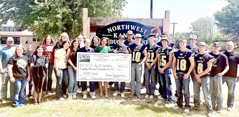 THE PALCO AG ENGINEERING AND TECHNOLOGY CLASS received a major boost with a $80,210.00 grant from the U.S. Department of Agriculture to help renovate the classroom, update desks and purchase flight simulators, drones and other equipment. On Friday, September 4th, Gimmie Jo Jansonious, USDA Rural Development Director forKansas presented the grant check to the school. (Photo Courtesy of Northwest Kansas Agricultural Education Center Foundation)