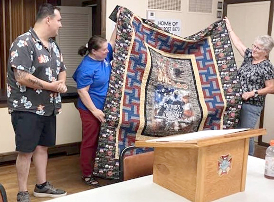 AFTER THE STOCKTON VFW #8873 AUXILIARY meeting on July 7th, President Deb Niermeier performed a Quilt of Valor ceremony for Peter Sabell. Pictured are Peter Sabell, Dena Bouchey (cousin to Peter), and Diane Maddy, who made the quilt.
