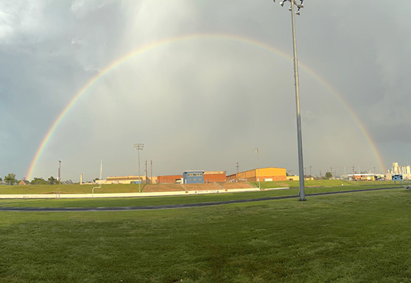 A COLORFUL KICKOFF TO THE 2025-26 SCHOOL YEAR— a rainbow stretches over Stockton schools and Tiger Stadium after a welcome rain shower Monday evening, offering a bright sign on the eve of the first day of the 2025-26 school year. (Photo courtesy of Alexa Rogers)