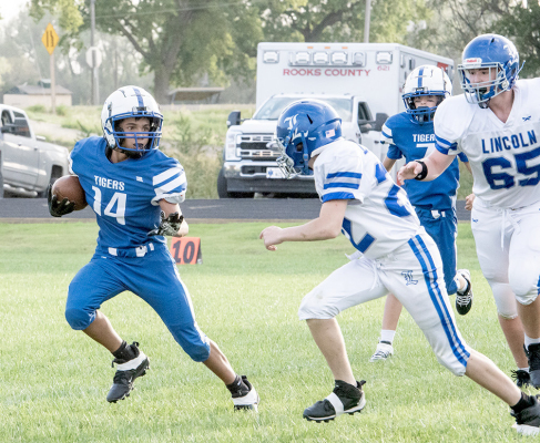 Stockton’s Jefferson Creighton looks to get by his Lincoln defenders
