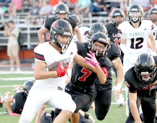 BRANTLEY LAWVER (#15) and Rowen Wyatt (#12) at Larned Jamboree (Photo Courtesy of PHS Yearbook)