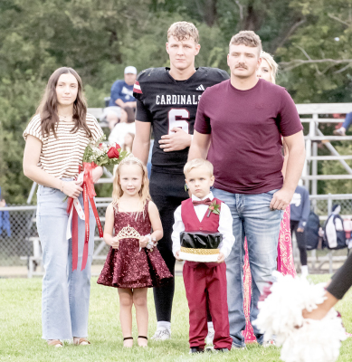 LAST YEAR’S HOMECOMING Queen and King at Plainville were Emma Fuzzell and Riddik Bethel. They, along with this year’s Junior Attendants Jensyn Nyp and Gus Brewster, await the much-anticipated announcement of the 2026 PHS King and Queen. In the background are candidates Owen Brewster and Khloe Nelson.