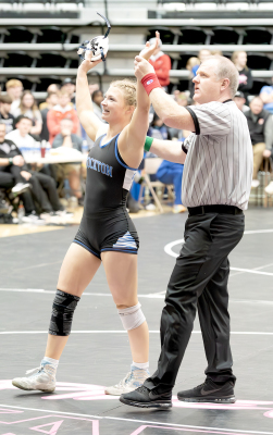ASHLYN HAHN celebrates her win over Avery Counts of Russell, capturing the 3-2-1A State Championship at 130.