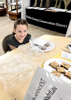 LAUREN FLOWER, a member of the Eager Beaver 4-H Club, had the muffins and cookies she baked for the First Year Foods Division judged on Monday morning of the Rooks County Free Fair.