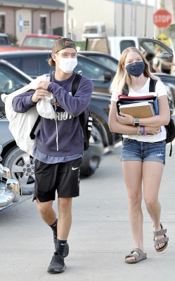 AFTER THE LONGEST SPRING BREAK EVER seniors Leighton Colburn and Logan Winklepleck make their way to school on their last first day of high school.