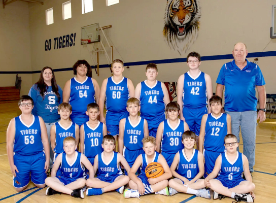 THE 2024-25 STOCKTON JUNIOR HIGH BOYS BASKETBALL TEAM MEMBERS were front row, from left: Maverick Post, Hudson Kriley, Grayson Mongeau, Eli Atkisson, and Brodey Odle; middle row, from left: Tristynn St. Clair, Lane Muir, Kyler Hrabe, Cobi Earl, Bentley Carpenter, and Vincent Antonini; and back row, from left: assistant coach Aftan Green, Sean Green, Hudson Muir, Garrison Mongeau, Justice Stice, and head coach Ray Niblock. Not pictured is Jefferson Creighton. (Photo courtesy of Julie Kuhlmann Photography)