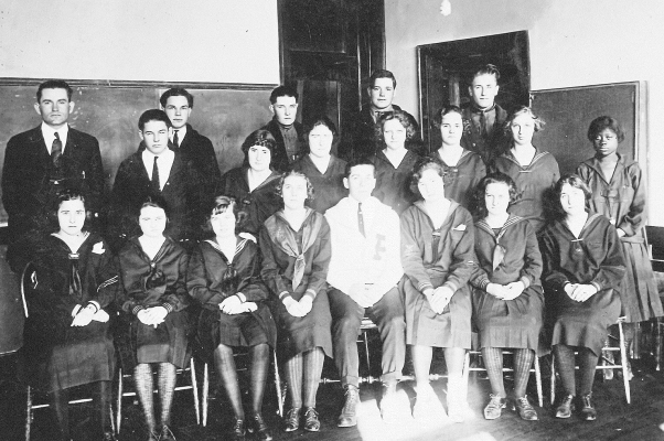 PICTURED IS THE PLAINVILLE HIGH SCHOOL CLASS OF 1924. They are (back row, from left): Mr. Russell, Edgar McReynolds, Claude Harris, David Gibbs, Hermon Ganoung, Case McCarrol; (middle row) Helen Starbuck, Bessie Beals, Velma Pywell, Alice Ross, Levora Baumgardner, Letha Thomas; (front row) Theodosia Yeagy, Olive Weaverling, Gladys Benedick, Thelda Ordway, Melvin Gumble, Della Bissett, Louisa Holmes, and Ina McCune.