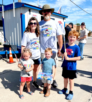 TOP FINISHERS INTHE 1-6 AGE GROUP at the Second Annual Werner's Minnow Races show off their prizes at the Paradise Creek Festival in Plainville last Saturday. Pictured left to right: Oakley Steier (1st), Daxon Dohe (2nd), and Leo Hillard (3rd).The races were sponsored by Tonia and Preston Werner (also pictured). Photo courtesy of Kacey Becker