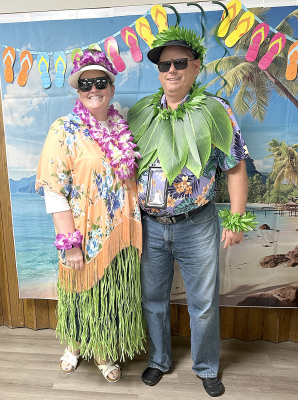 Staci and Shawn “The Farmer” McReynolds in their winning Hawaiian costumes.