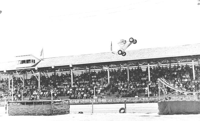 DURING THE ROOKS COUNTY FREE FAIR INTHE 1960S, the Swenson Thrillcade had the crowds flocking to the grandstands and on the edge of their seats to watch their heart-stopping aeral maneuvers and gravity-defying stunts!