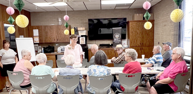 STEPHANIE NIBLOCK with Fort Hays State giving a program on Senior Companions and Foster Grandparents during the Adult Social/Coffee Hour on Tuesday, August 18.