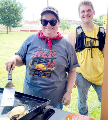 Dena Bouchey and Chevy Bouchey cooking up smashburgers for Red Fest 2026