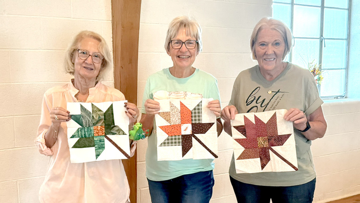 CELESTE CLORE, Mary Smith, and instructor Janie Lowry proudly display a completed leaf block at the Hansen Museum’s Hello Fall! Table Runner Sewing Class, held Saturday at the Logan Youth Center. (Courtesy Photo)