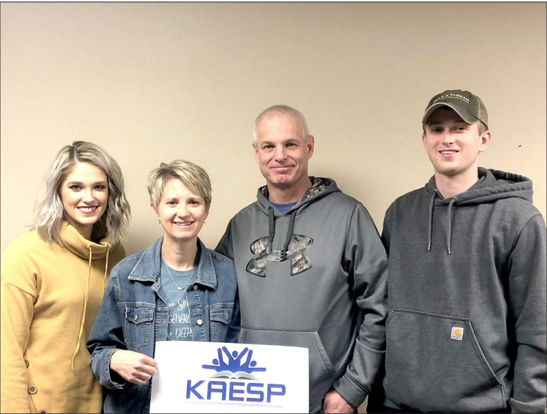 STOCKTON GRADE SCHOOL PRINCIPAL STACEY GREEN is pictured with her family after the announcement of Stacey being awarded National Distinguished Principal. Pictured are (from left): Audrey Rahjes, Stacey Green, Kirk and Joel Green.