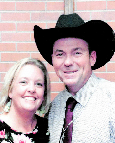 WITH HIS WIFE CRYSTAL BY HIS SIDE, Pastor Ted Stapleton ministers to the congregation of the Church of Restoration in Stockton.