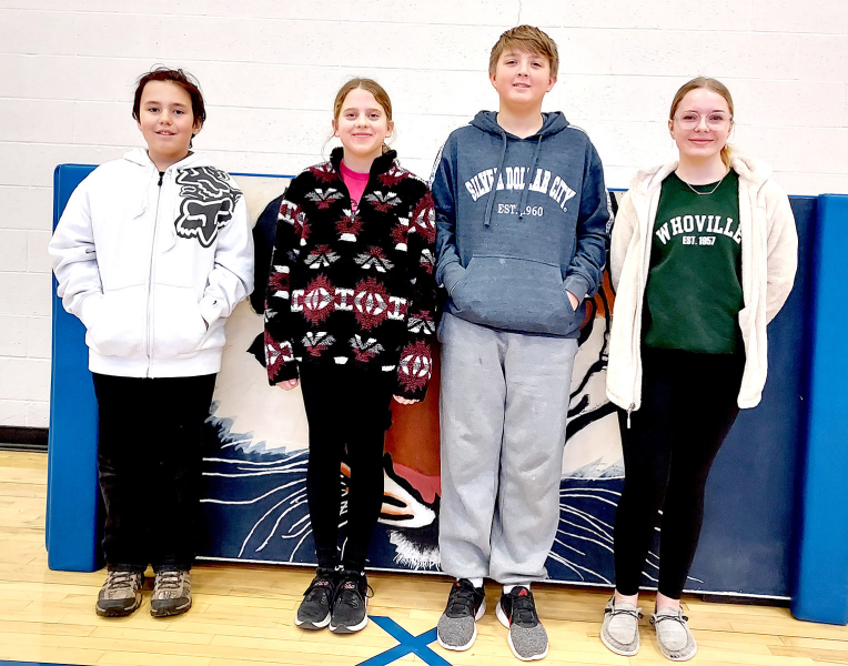 REPRESENTING STOCKTON GRADE SCHOOL at the Rooks County Spelling Bee on Wednesday, February 8th, at the Nova Theatre are (from left): champion Golden Potter, Mia Odle, Damon Muir, and Lyric Snyder.