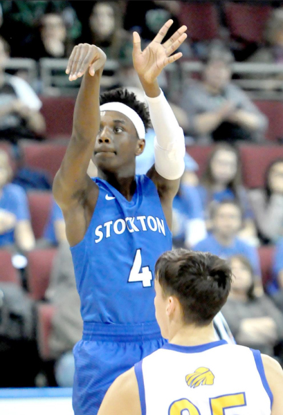 JOSH COLEMAN, a sophomore, follows through on his threepoint shot during quarterfinal action in the state basketball tournament held on March 11 at United Wireless Arena.