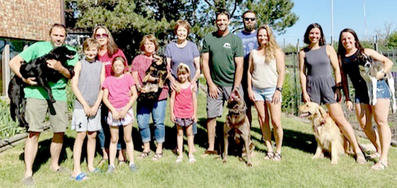 FAMILY MEMBERS helping Joan Balderston celebrate her 89th birthday last weekend included, from left: J.D. Niermeier (holding Blue), Austen Niermeier, Deb Niermeier, Addy Niermeier, Kathy Balderston (holding Buddy), Joan Balderston, Millie Niermeier, Bill Balderston (with Sage), Andrew Niermeier, Andrea Niermeier, Ally Balderston (with Wanda), and Nicole Balderston (with Von).