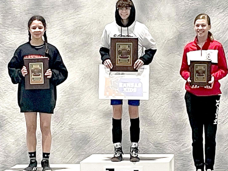 CAROLINA NORTHUP (center) won the State USAWKS Folkstyle Wrestlng Championship in the Girls’ 14 &amp;amp; Under 92-lb. division in Topeka March 12 and 13.