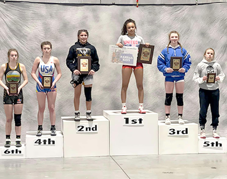 ASHLYN HAHN (second from right) placed third at the USAWKS 2022 State Folstyle Wrestling Championships in Topeka in the Girls’ 14 &amp;amp; Under 119-lb. division.