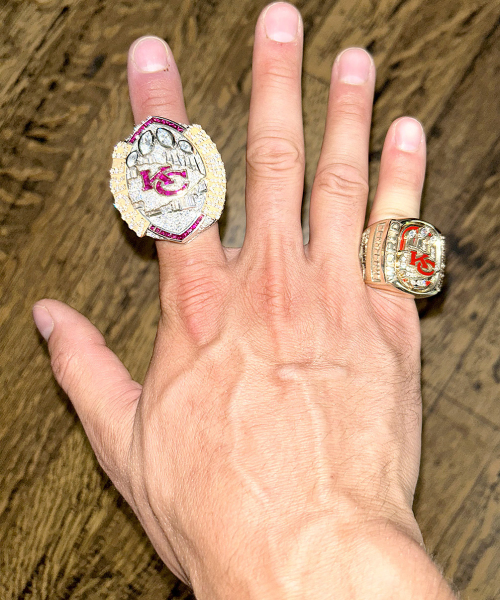 ANDREW RECEIVED TWO SUPER BOWL RINGS from the Kansas City Chiefs organization after their back-to-back Super Bowl wins. The smaller one on his pinky is when he was working in a part-time seasonal position for the team. Bellerive received the larger ring from the 2024 Super Bowl win against the San Francisco 49ers since he is now a full-time employee of the Chiefs organization.