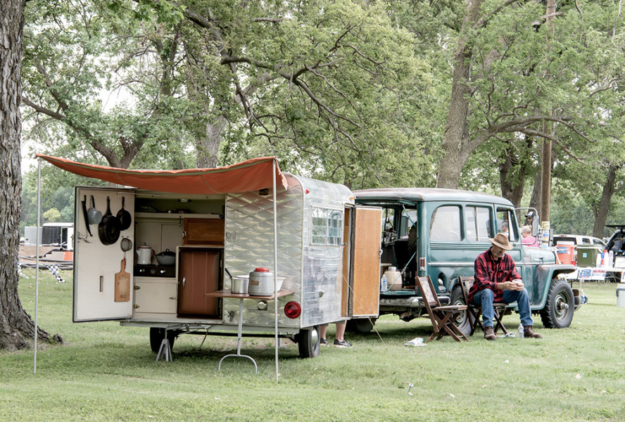 ROD CAMPBELL was enjoying all the outdoors had to offer as he sat and relaxed during the Car Show on Saturday. His 1958 Willys Jeep Wagon won the Most Nostalgic Vehicle award.