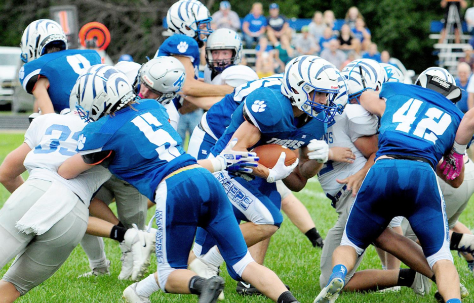 TOUCHDOWN RUN! Camden Iwanski, a Tiger senior, scored a touchdown on Stockton’s first offensive play of the game against Thunder Ridge, after managing to get through this traffic with the help of his blockers, Emerson Lowry, #5, and Rylan Basart, #42.