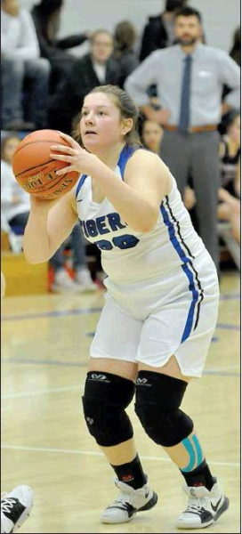 MACY ODLE SPOTS UP for a three-pointer in the Lady Tigers’ overtime win over the visiting Plainville Lady Cards last Friday night.