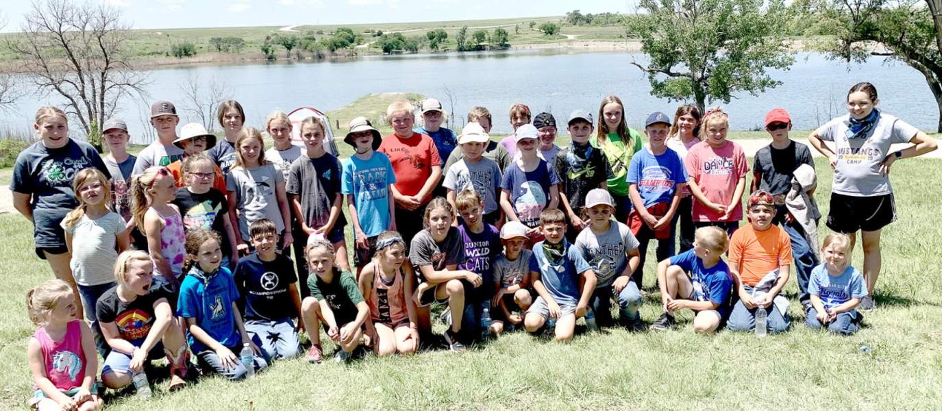 LOTS OF FISH were caught by this group at the Outdoor Adventure Day Camp held on Monday, June 6, at the Rooks State Fishing Lake, with Jake Brooke, Graham and Rooks County Game Warden, and Chris Hanson, Kansas Forest Service, sharing their expertise with the youth. The youth enjoyed playing games, such as cornhole, washers, horseshoes, and parachute.