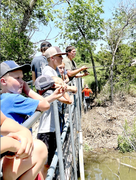 ONE OF THE MANY activities enjoyed by the kids attending the Outdoor Adventure Day Camp was fishing from the walking bridge.