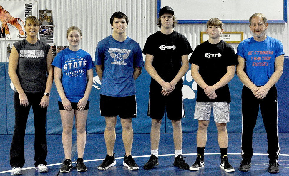 TIGER POWERLIFTERS who competed in the Blue Ace Power Invitational virtual meet are from left: Coach Janet Kuhlmann, Katy Post, Zach Young, Trent Becker, Cason Iwanski and Coach Justin Basart.
