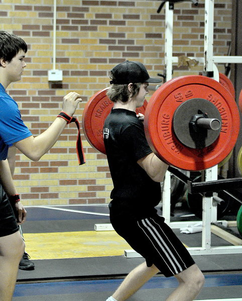TRENT BECKER, executing the clean lift, finished 11th overall out of 29 competitors in his weight class. Zach Young was his spotter.