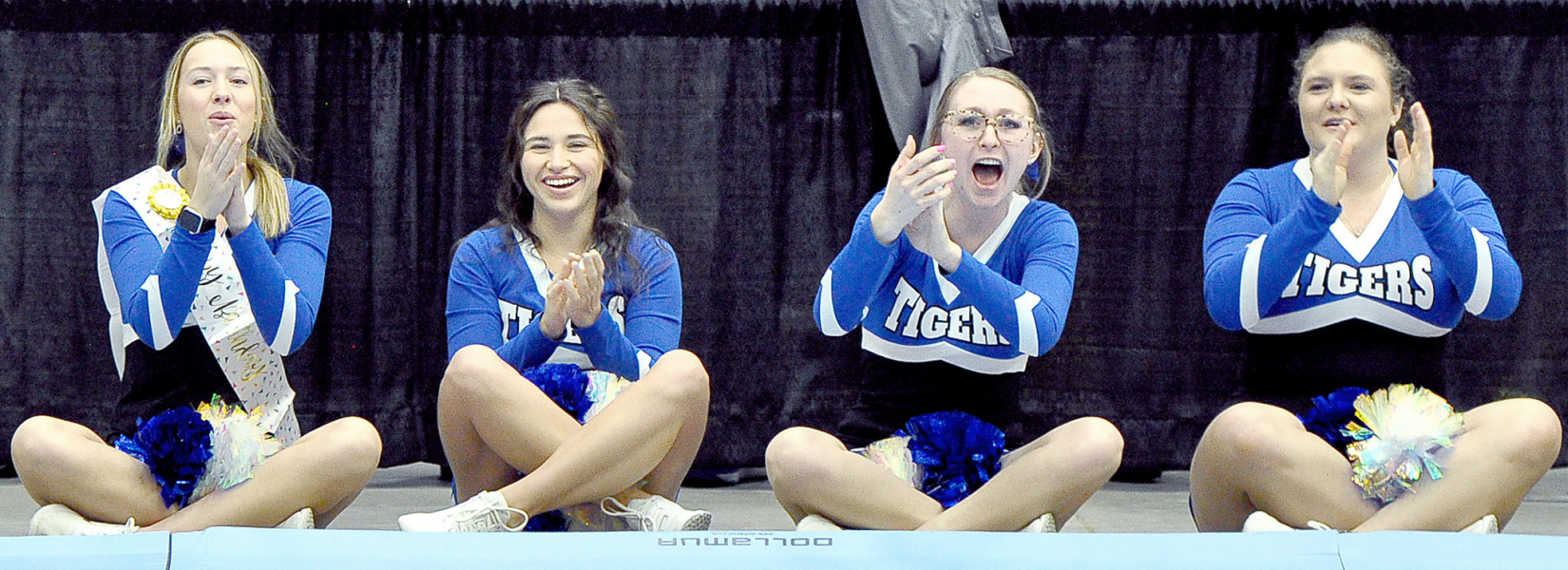 Cheering on the Tigers in Salina are Claire Plumer, Taigen Kerr, Delanee Bedore and Addie Struckhoff