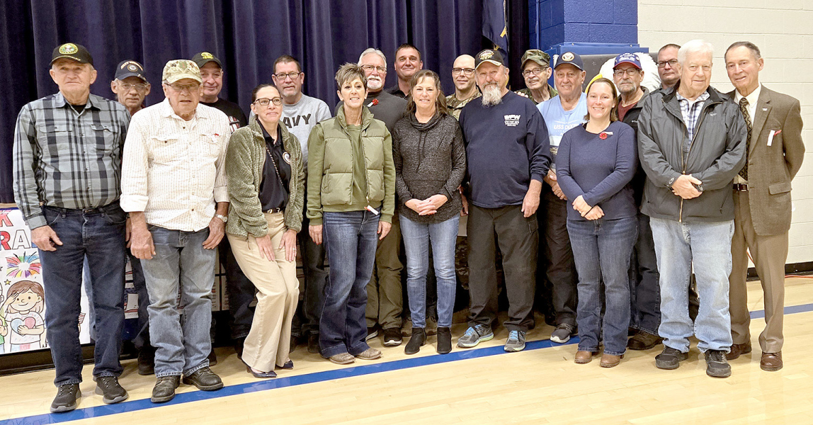 HOMETOWN HEROES gathered at the Veterans Day program at Stockton High School on Tuesday, November 11th. In the front row, from left to right, are Rick Lowry, Ken Dreiling, Angela McCollum, Jill Jantz, Mary Jo Laurin, Mack Palmer, Mara Morgan, and Don Maddy. In the back row, from left to right, are Mike Blackburn, Ed Thayer, Tim Johnston, Jack Laurin, Joel Laurin, Tobias Wood, Dave Denton, Ed Foster, Delwin LaRue, Shayn Balthazor, and Thomas Riffe.