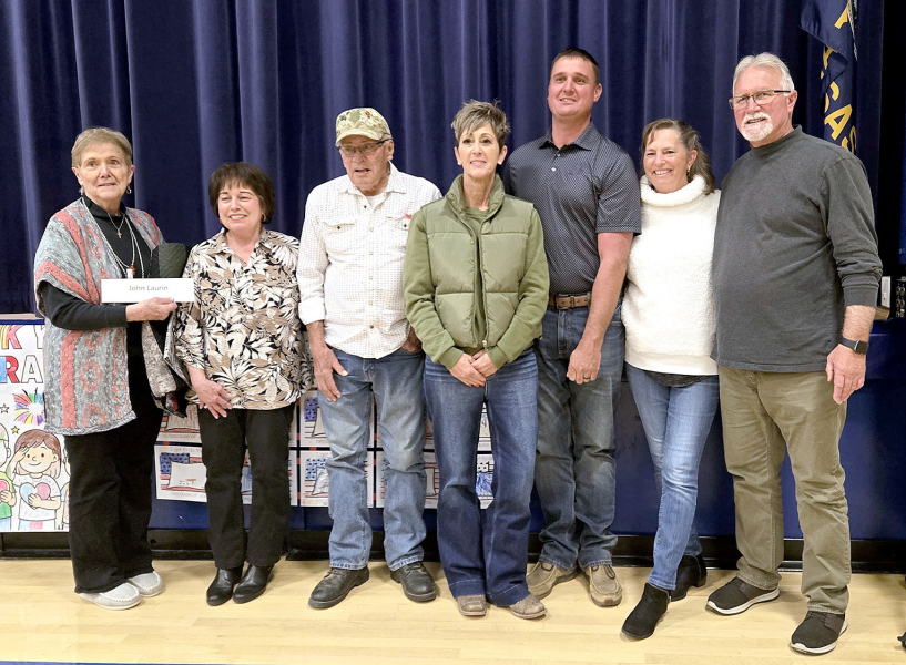 CINDY NEWELL made seven of the Quilts of Valor presented at the Veterans Day program held at Stockton High School on Tuesday, November 11th. Pictured are Irma Newell, who accepted the quilt for her son, John; Cindy Newell; Ken Dreiling; Jill Jantz; Joel Laurin; Mary Jo Laurin; and Jack Laurin. This touching presentation was particularly special as Cindy is the aunt and Irma is the mother of siblings John, Jill, Joel, Mary Jo, and Jack.