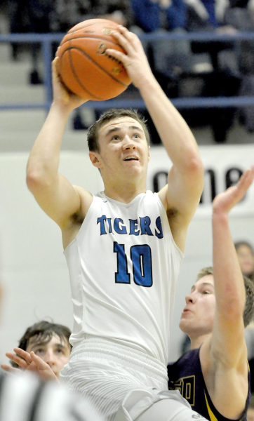 ETHAN MEANS goes to the basket for two of his 10 points in the Tigers’ 44-40 win over the Trego Golden Eagles last Tuesday night.
