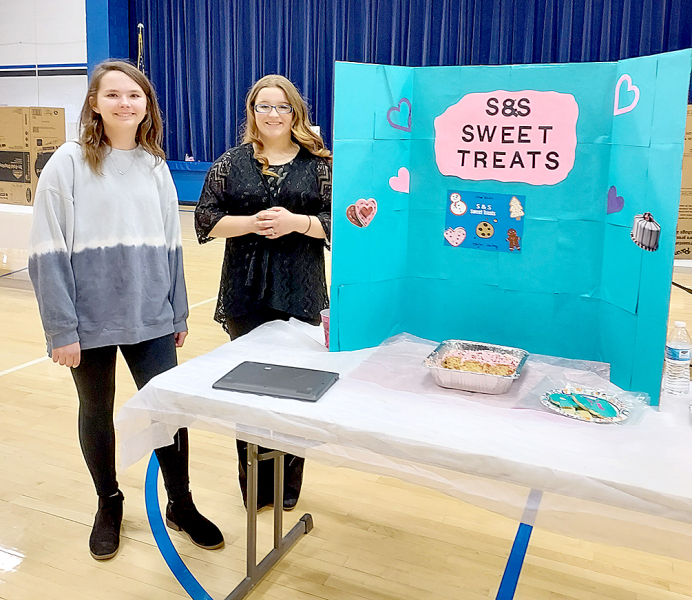 SHAE YOHON and Skylar Amlong (Stockton) presented their “S&amp;S Sweet Treats” at the Rooks County YEC.