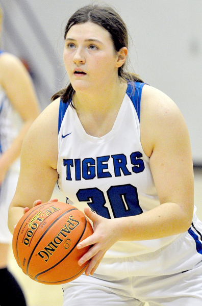 KAELYN MEANS, a Lady Tiger junior, focuses on the goal prior to shooting a free throw during action against Lakeside.
