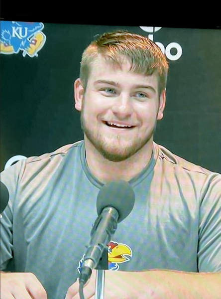 JARED CASEY, a freshman redshirt for the KU Jayhawks, answers questions during a post-game press conference following the Jayhawks’ overtime win over Texas last Saturday.