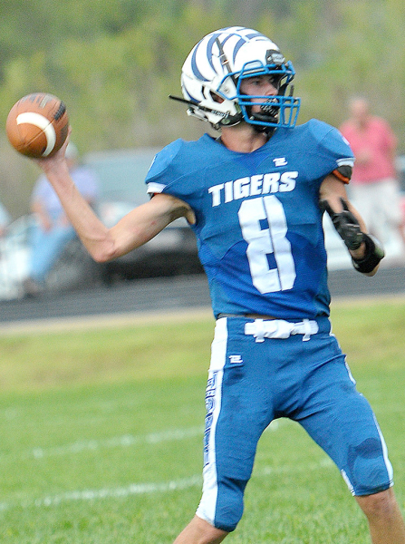 MAX MOFFET looks to throw a pass in last Friday night’s football action against Logan/Palco.