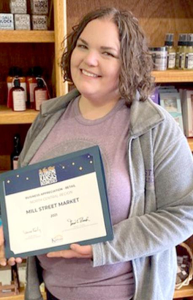 DEANNA HAMMERSCHMIDT, owner of Mill Street Market, was a Merit Award winner at the Kansas Department of Commerce’s annual BAM Award Luncheon.