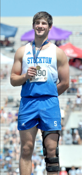 RYLAN BASART stands atop the podium at the KSHSAA State Track &amp;amp; Field Championships after winning the Javelin.