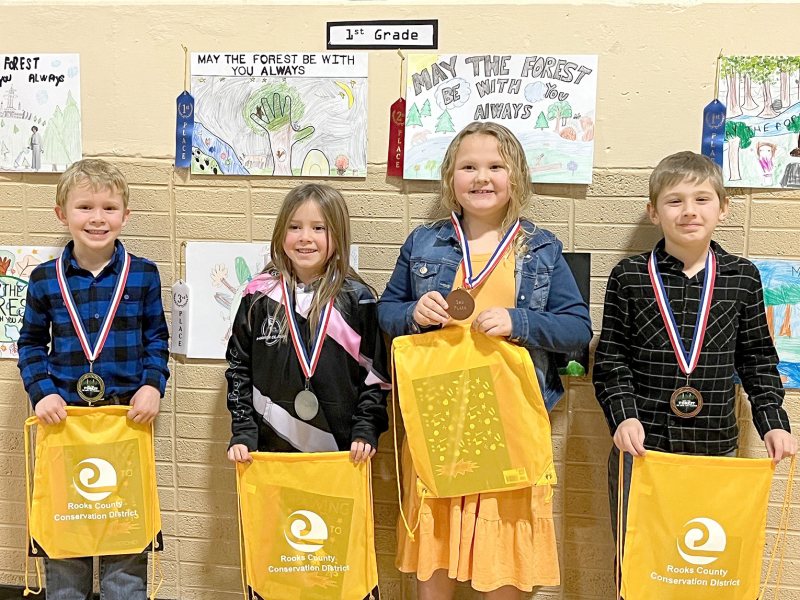 FIRST-GRADE POSTERWINNERS (l to r)—1st, Carson Riener, Stockton; 2nd, Bridgett Axelson, Plainville; 3rd, Carsen Balthazor, Plainville; and 4th, Dayton Kuhn, Damar.