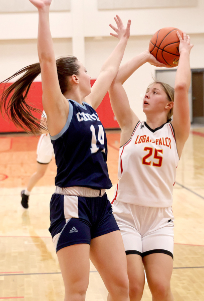 IN THE LOGAN-PALCO vs. Cheylin High School JV game, freshman Shiloh Kuhn puts up the shot. Shiloh scored 11 in the varsity game. (Photo Courtesy of Shannon Kats)